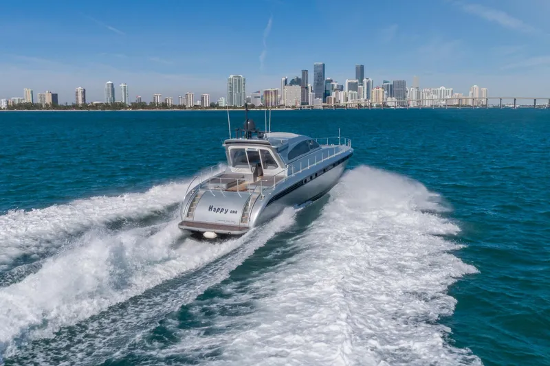 Slide: The Image of 2007 Leopard Express Motor Yacht cruising near city skyline on blue ocean waters. - 7