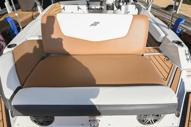 Slide: The Image of 2023 Starcraft SVX 230 IO boat interior with tan and white seating. - 10