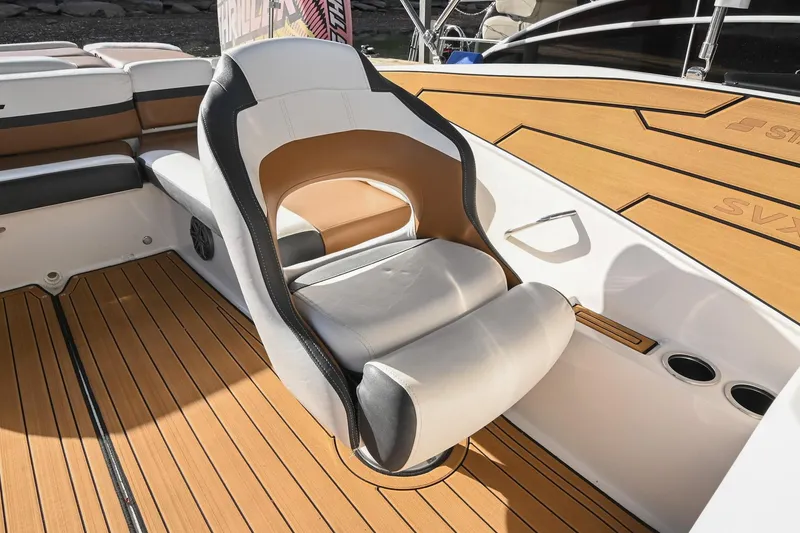 Slide: The Image of 2023 Starcraft SVX 230 IO boat interior with stylish seating and wood-like flooring. - 22