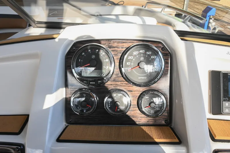 Slide: The Image of Dashboard of 2023 Starcraft SVX 230 IO boat with speedometer and gauges. - 26