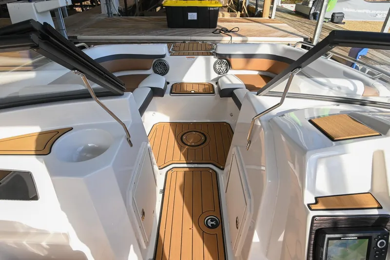 Slide: The Image of 2023 Starcraft SVX 230 IO boat interior with teak flooring and modern seating. - 31