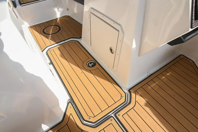 Slide: The Image of 2023 Starcraft SVX 230 IO boat interior with teak-style flooring. - 32