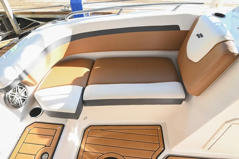 Slide: The Image of 2023 Starcraft SVX 230 IO boat interior with tan and white seating. - 38