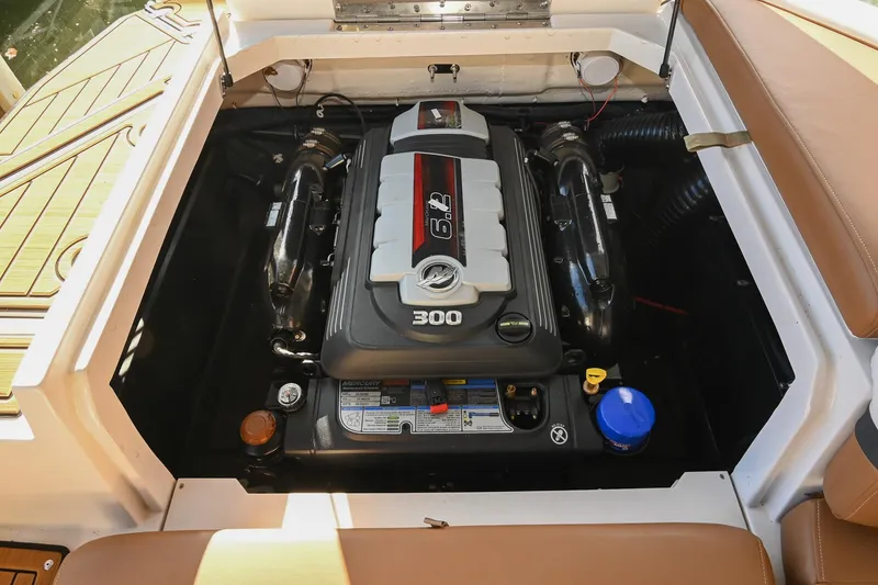 Slide: The Image of 2023 Starcraft SVX 230 IO boat engine compartment with 300 HP motor. - 42