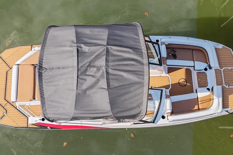 Slide: The Image of 2023 Starcraft SVX 230 IO boat with canopy, aerial view on water. - 5