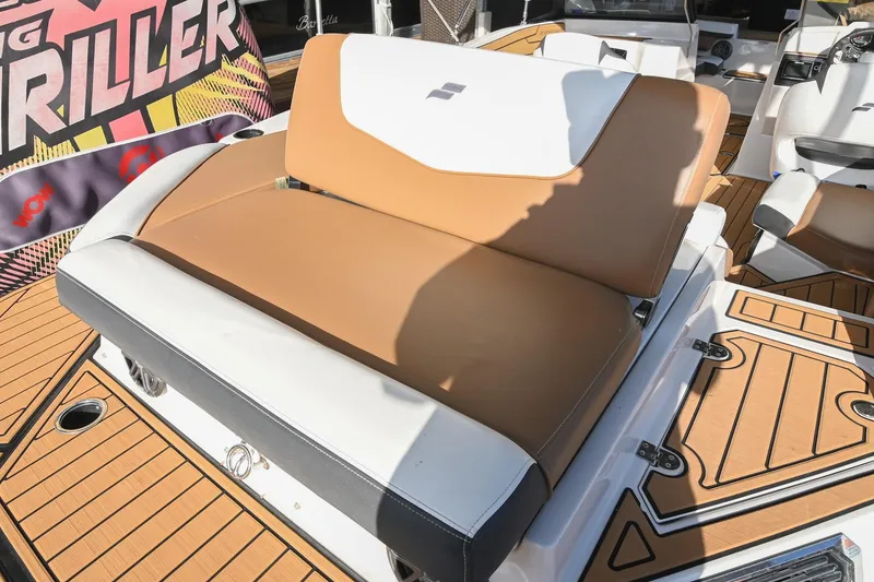 Slide: The Image of 2023 Starcraft SVX 230 IO boat interior with tan and white seating. - 9