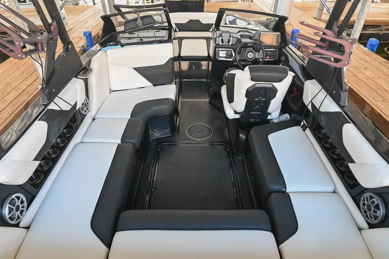 Slide: The Image of 2022 Axis A22 boat interior with modern seating and dashboard design. - 13