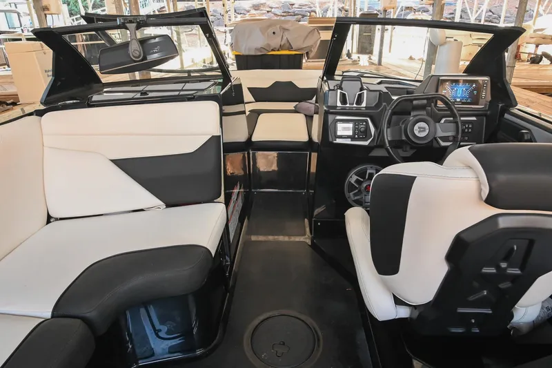 Slide: The Image of 2022 Axis A22 boat interior with modern dashboard and comfortable seating. - 21
