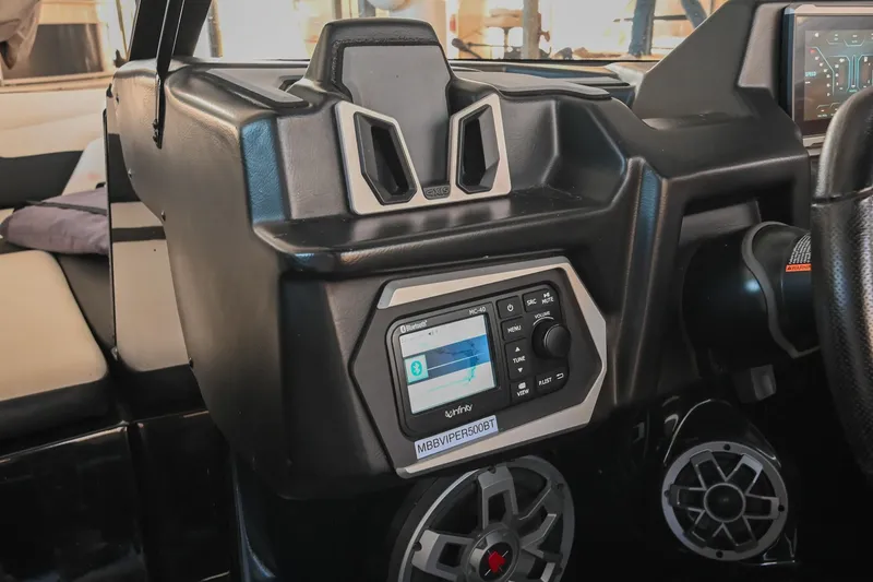 Slide: The Image of 2022 Axis A22 boat dashboard with Bluetooth stereo system and speakers. - 27