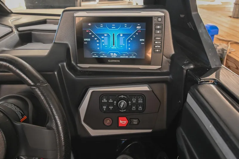Slide: The Image of 2022 Axis A22 dashboard with Garmin display and control panel. - 28