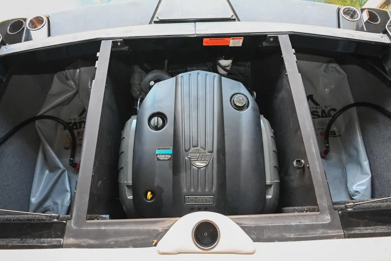 Slide: The Image of 2022 Axis A22 boat engine compartment with visible engine components. - 39