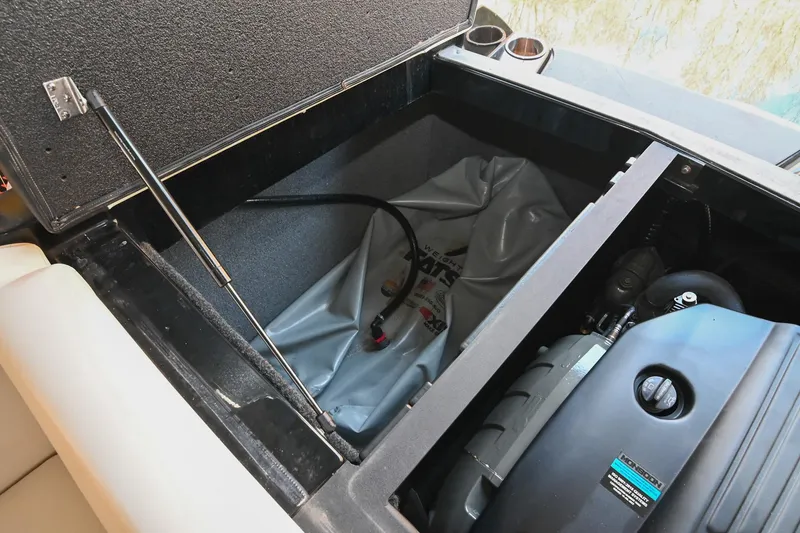 Slide: The Image of 2022 Axis A22 boat storage compartment with engine and ballast bag. - 41