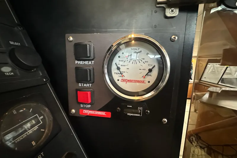 Slide: The Image of Control panel of a 1999 Bayliner 4788 Pilot House Motoryacht with Westerbeke gauges. - 21