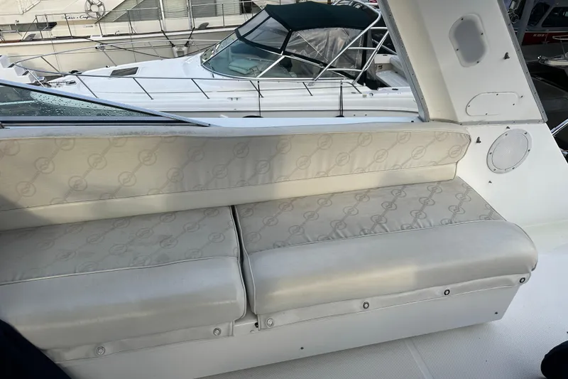 Slide: The Image of 1999 Bayliner 4788 Pilot House Motoryacht interior seating with patterned upholstery. - 30