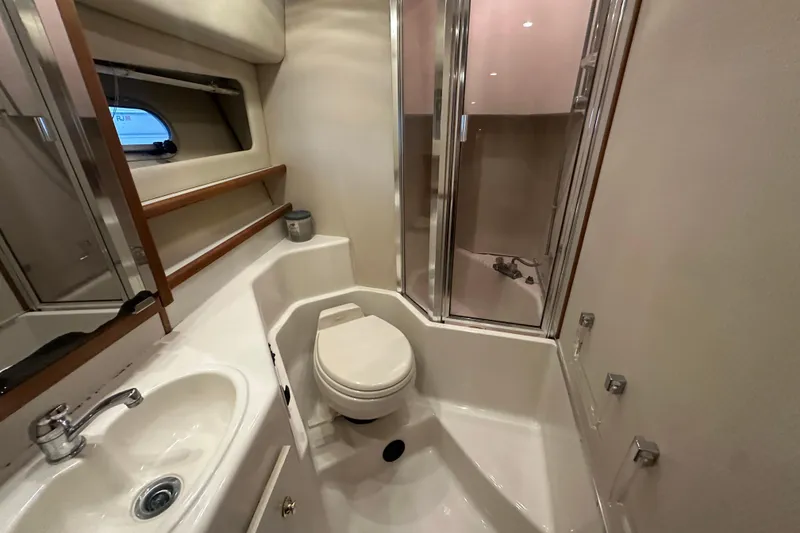 Slide: The Image of Bathroom of 1999 Bayliner 4788 Pilot House Motoryacht with shower, sink, and toilet. - 39