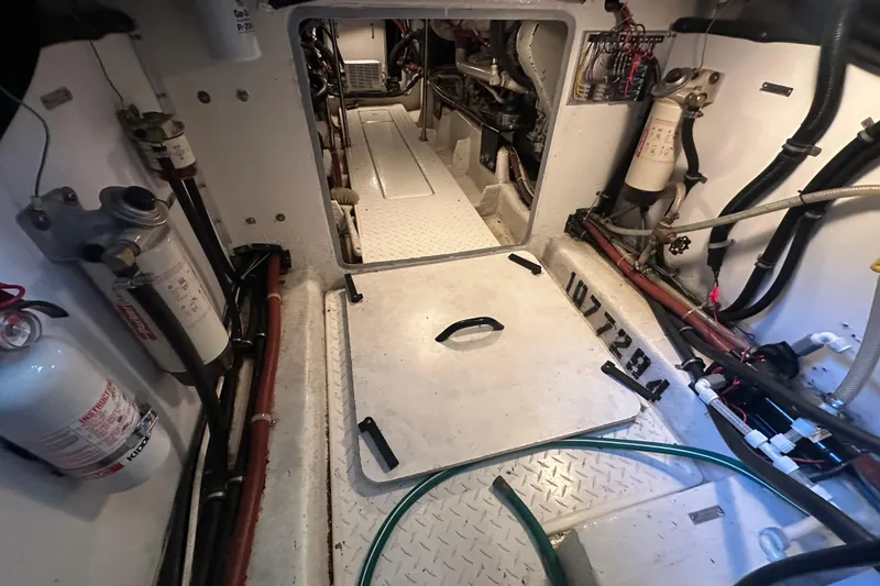 Slide: The Image of Engine room of 1999 Bayliner 4788 Pilot House Motoryacht with visible equipment and wiring. - 40