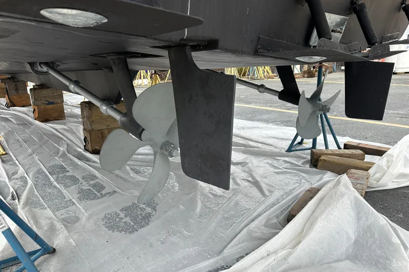 Slide: The Image of 1999 Bayliner 4788 Pilot House Motoryacht propellers and rudders on dry dock. - 45