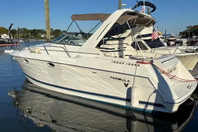 The Image of 2000 Formula 31 Performance Cruiser docked in a marina, side view. - 0