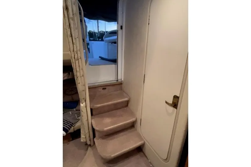 Slide: The Image of Interior stairs of 2000 Formula 31 Performance Cruiser, leading to deck area. - 12