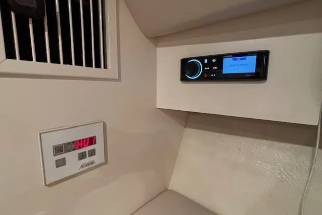 Slide: The Image of 2000 Formula 31 Performance Cruiser interior with control panel and stereo system. - 16