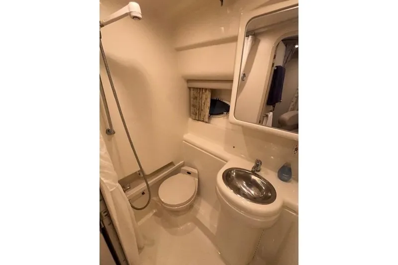 Slide: The Image of Bathroom of 2000 Formula 31 Performance Cruiser with shower, toilet, and sink. - 17