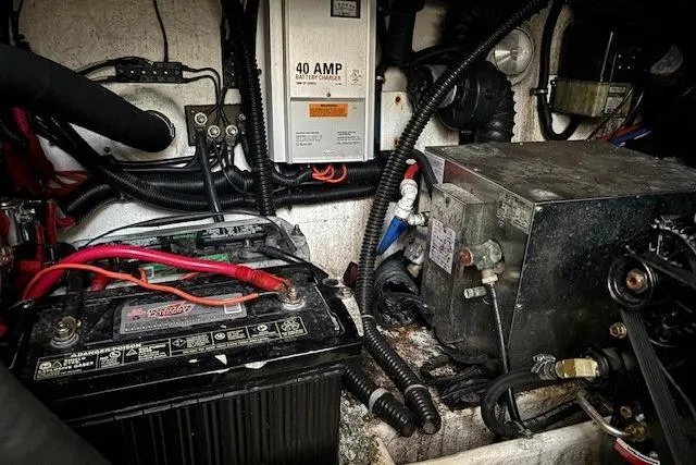 Slide: The Image of Engine compartment of 2000 Formula 31 Performance Cruiser with battery and wiring. - 23