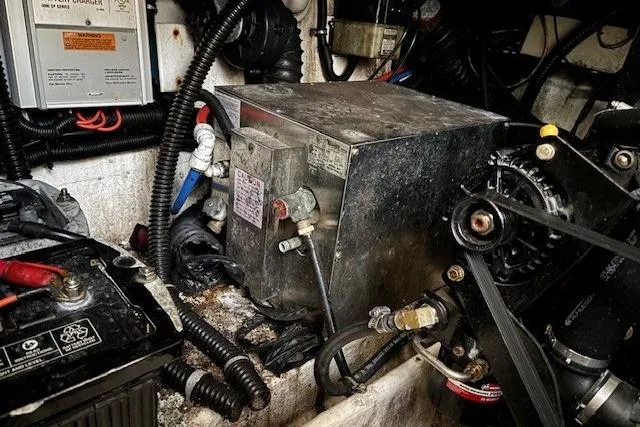 Slide: The Image of Engine compartment of a 2000 Formula 31 Performance Cruiser, showcasing mechanical components. - 24