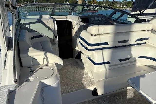 Slide: The Image of 2000 Formula 31 Performance Cruiser interior with white seating and control panel. - 8