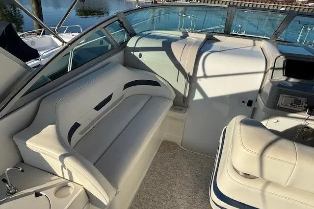 Slide: The Image of 2000 Formula 31 Performance Cruiser interior with white seating and control panel. - 9