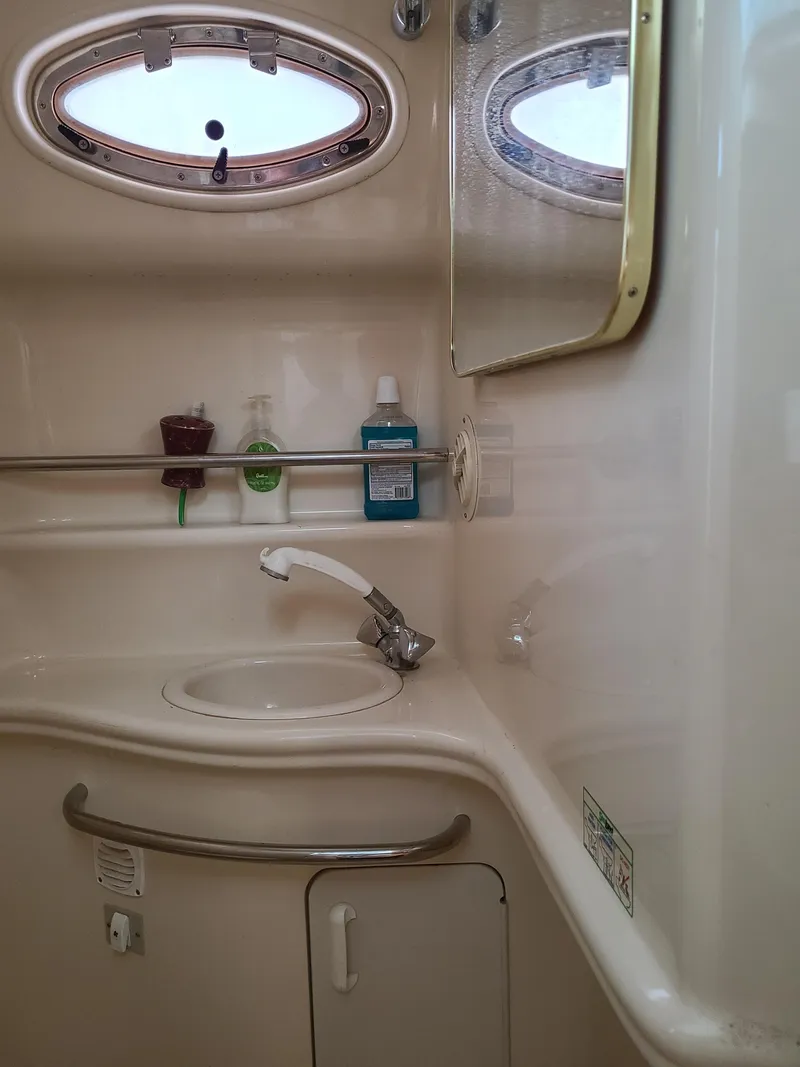 Slide: The Image of Interior of 1999 Sea Ray 340 Sundancer, bathroom with sink and mirror. - 16