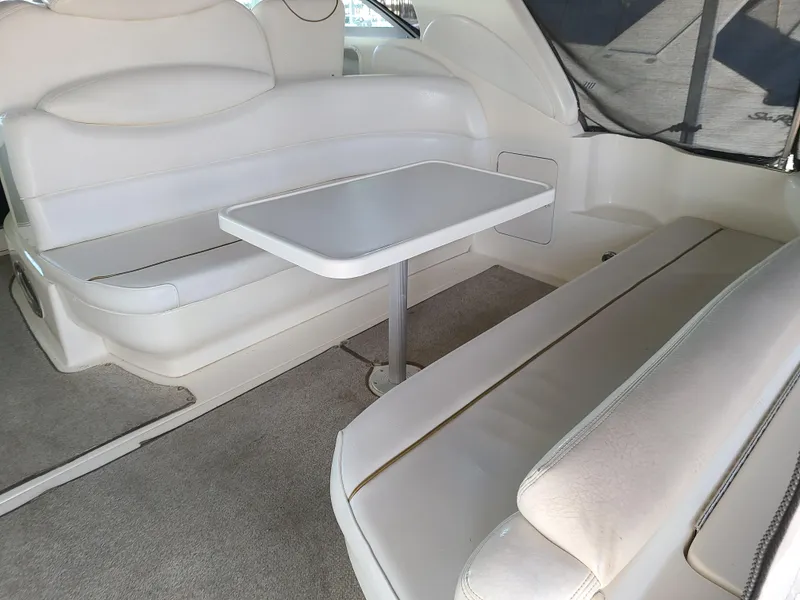 Slide: The Image of Interior of 1999 Sea Ray 340 Sundancer with seating area and table. - 5