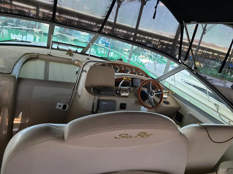 Slide: The Image of Interior of a 1999 Sea Ray 340 Sundancer boat with steering wheel. - 7