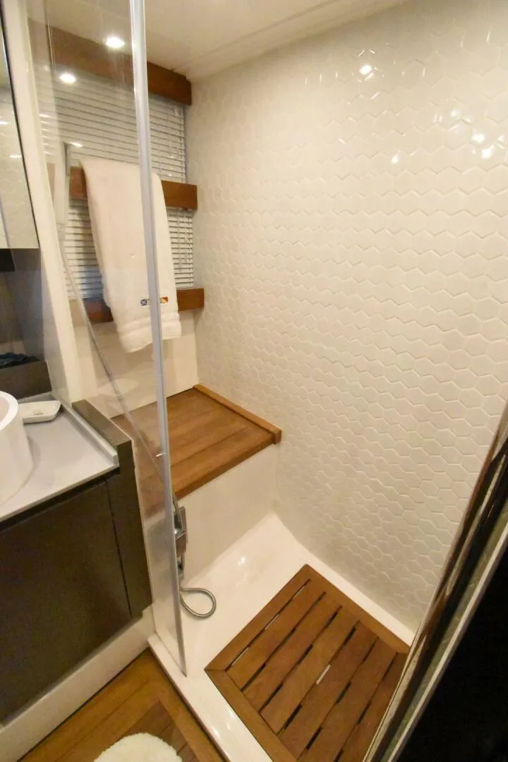 Slide: The Image of Luxurious 2024 OKEAN 52 yacht bathroom with modern shower design. - 10