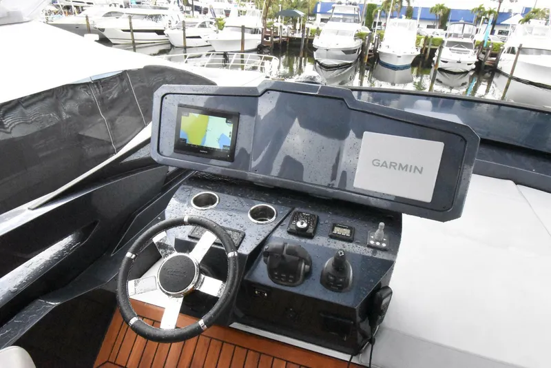 Slide: The Image of 2024 OKEAN 52 yacht helm with Garmin navigation system, docked at marina. - 14