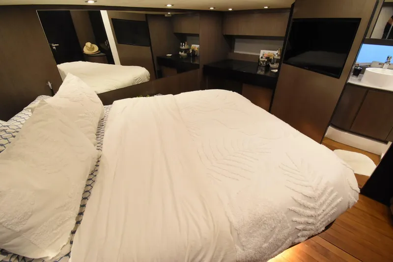 Slide: The Image of Luxurious bedroom interior of 2024 OKEAN 52 yacht with modern design and cozy bedding. - 22