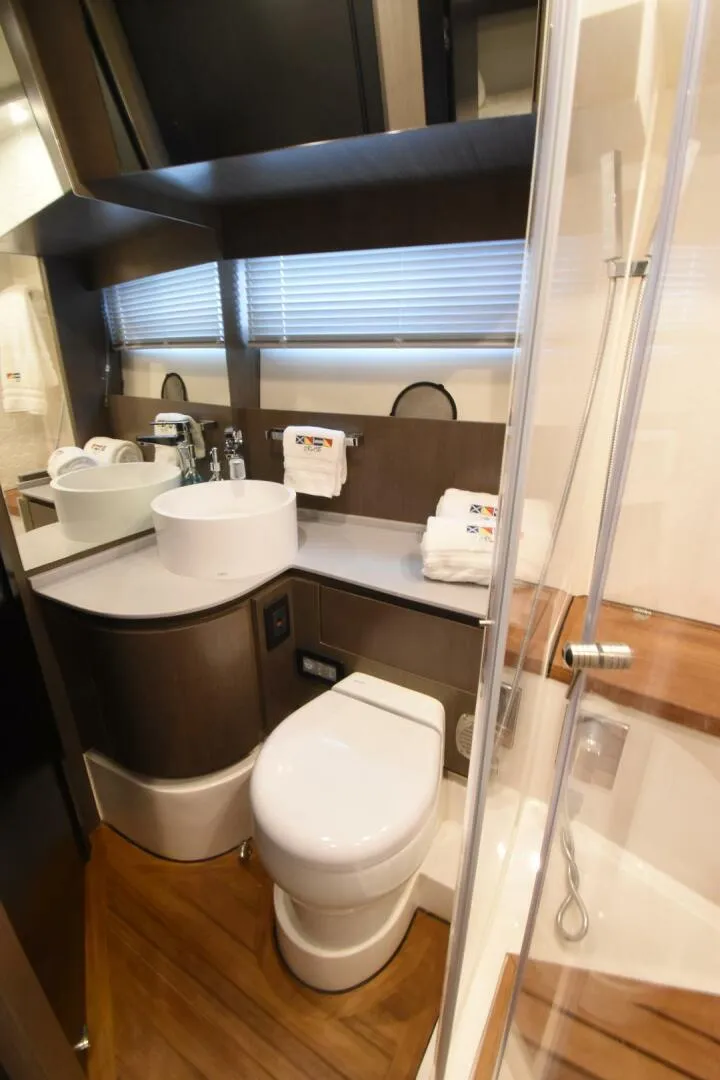 Slide: The Image of Luxurious bathroom in 2024 OKEAN 52 yacht with modern fixtures and elegant design. - 24