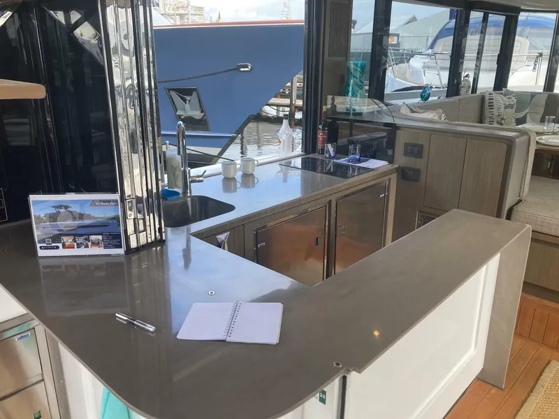 Slide: The Image of Modern kitchen area on 2024 OKEAN 52 yacht with sleek countertops and appliances. - 37