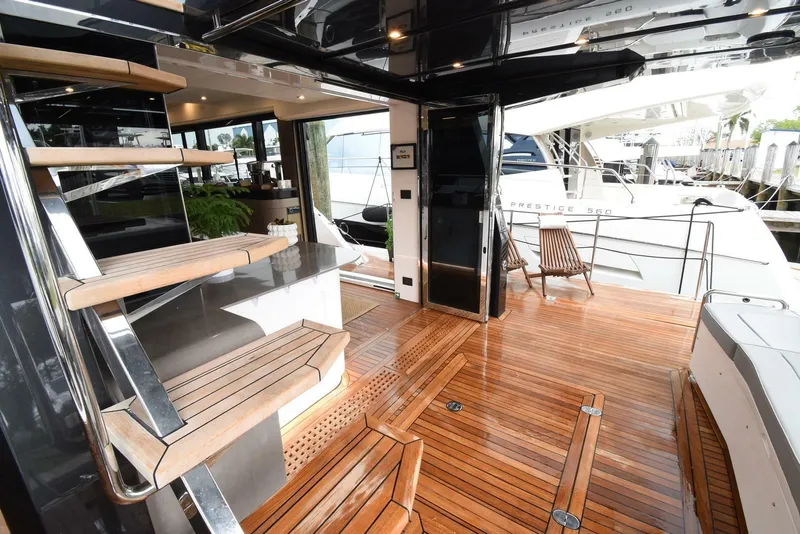 Slide: The Image of Luxurious 2024 OKEAN 52 yacht interior with sleek wooden flooring and modern design. - 5