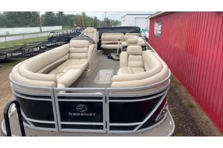 Slide: The Image of 2016 Regency 220 DL3 pontoon boat with beige seating and sleek design. - 3