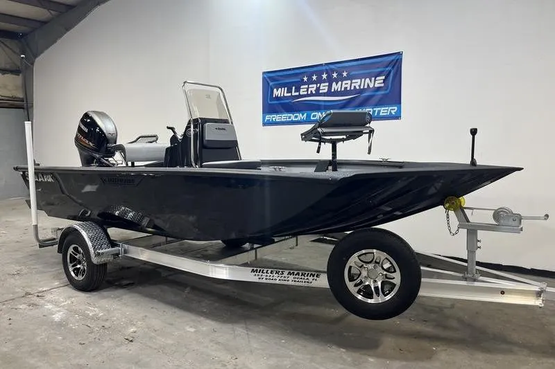 Slide: The Image of 2025 SeaArk Shadow 187T boat on trailer at Miller's Marine showroom. - 1