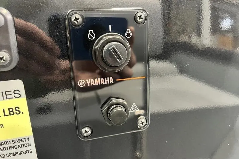 Slide: The Image of Yamaha control panel on 2025 SeaArk Shadow 187T boat, featuring ignition switch. - 12
