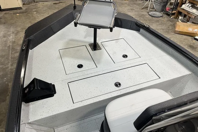 Slide: The Image of 2025 SeaArk Shadow 187T boat interior with seating and storage compartments. - 14