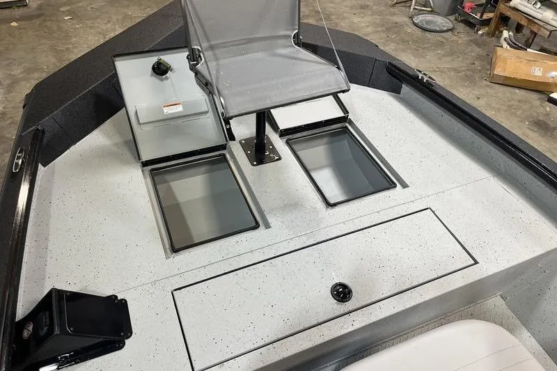 Slide: The Image of 2025 SeaArk Shadow 187T boat interior with seating and storage compartments. - 15