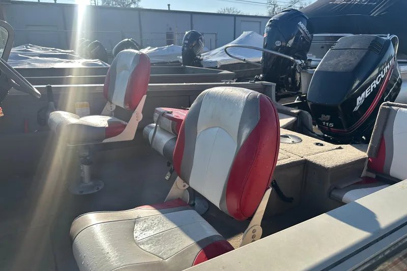 Slide: The Image of 2006 Lowe Fish & Ski 175 boat interior with red and white seats, Mercury 115 engine. - 4