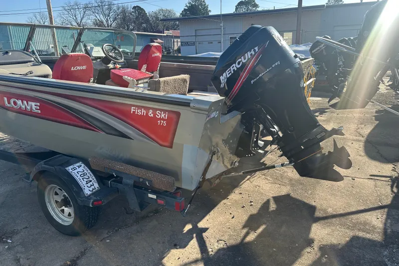 Slide: The Image of 2006 Lowe Fish & Ski 175 boat with Mercury outboard motor in a sunny outdoor setting. - 7