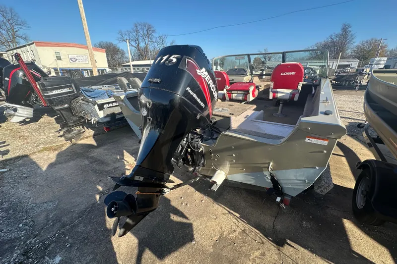 Slide: The Image of 2006 Lowe Fish & Ski 175 boat with Mercury outboard motor, parked outdoors. - 8