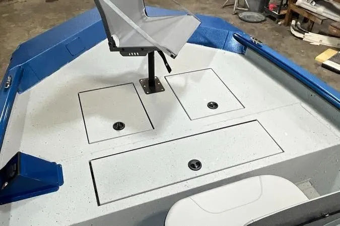 Slide: The Image of 2025 SeaArk Shadow 187T boat interior with storage compartments and seating. - 10