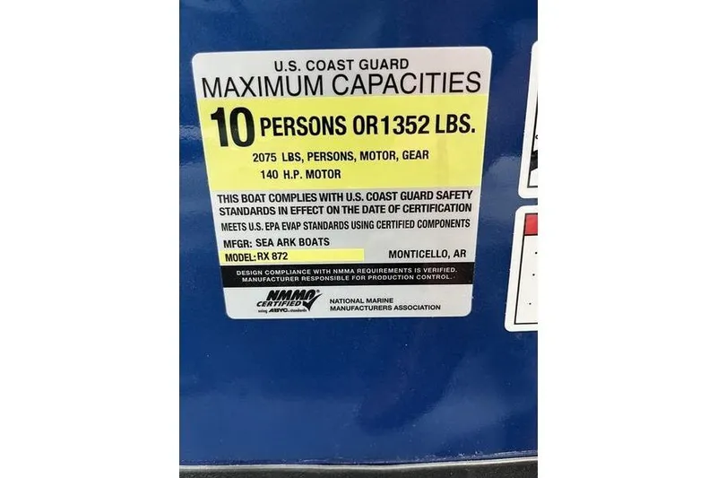 Slide: The Image of SeaArk Shadow 187T 2025 boat capacity label, 10 persons or 1352 lbs, 140 HP motor. - 12