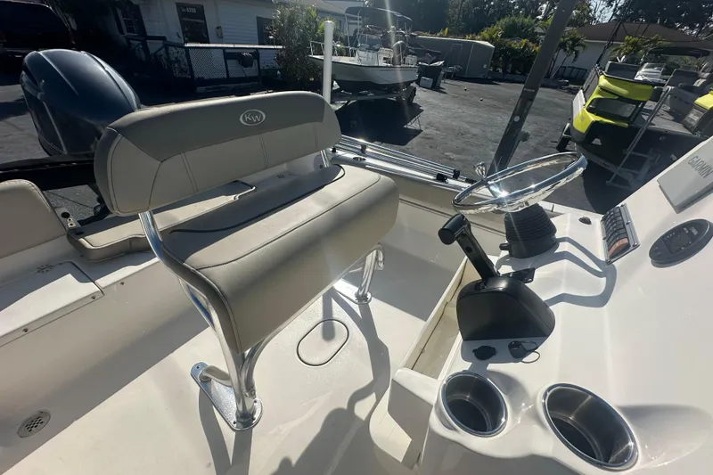 Slide: The Image of 2024 Key West 189 FS boat interior with steering console and seating. - 17