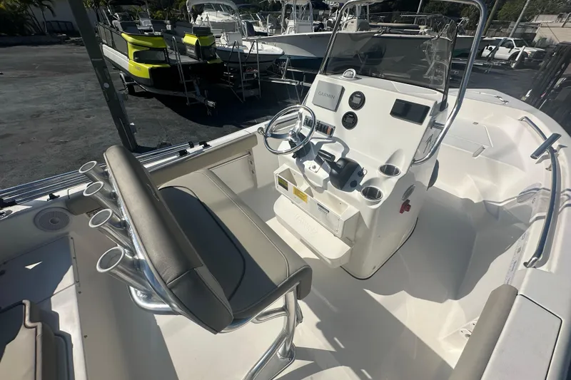 Slide: The Image of 2024 Key West 189 FS boat interior with steering console and seating. - 18